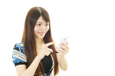 Woman with smart phoneの写真素材