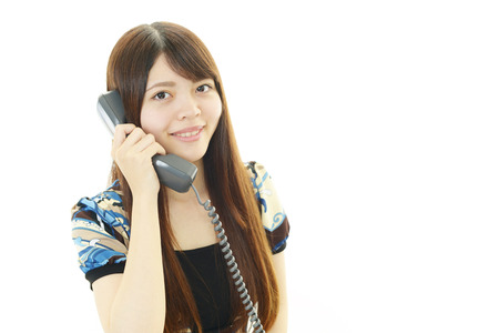 A woman with handsetの写真素材