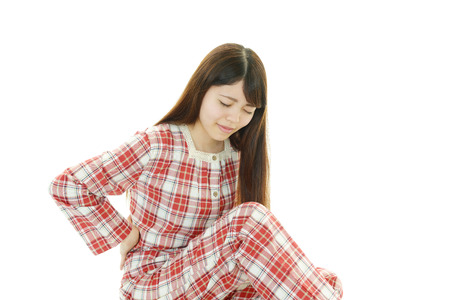 A woman with back painの写真素材