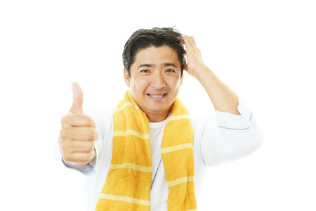 A man taking care of his hairの写真素材