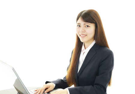 Business woman working on laptopの写真素材