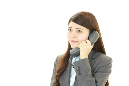 Business woman with phoneの写真素材