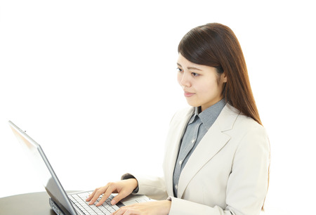 Business woman working on laptopの写真素材