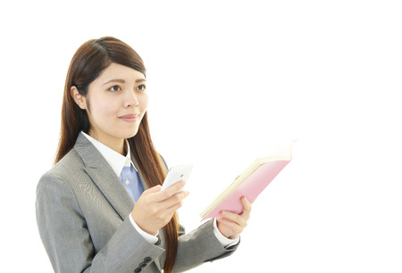 Woman with smart phoneの写真素材