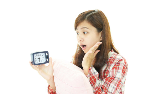The woman who is surprised to watch timeの写真素材