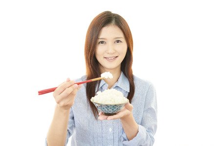 Women who eating riceの写真素材