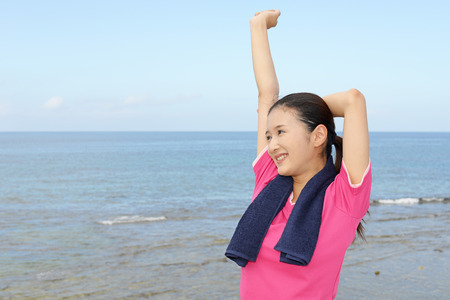 Beautiful woman doing stretchの写真素材