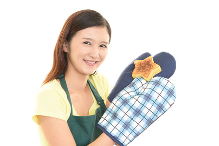Smiling woman with sweets.の写真素材
