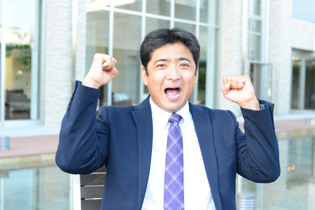 Smiling Asian businessmanの写真素材