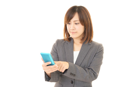 Woman with a smart phoneの写真素材