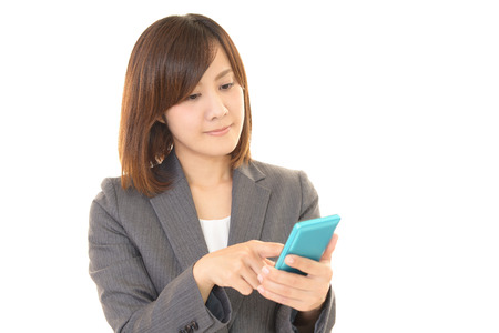 Woman with a smart phoneの写真素材