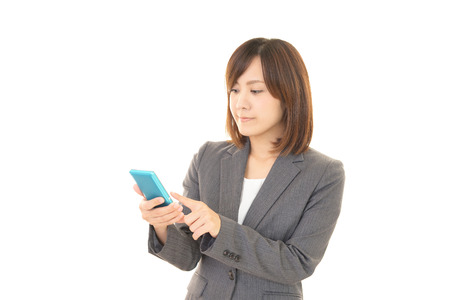 Woman with a smart phoneの写真素材