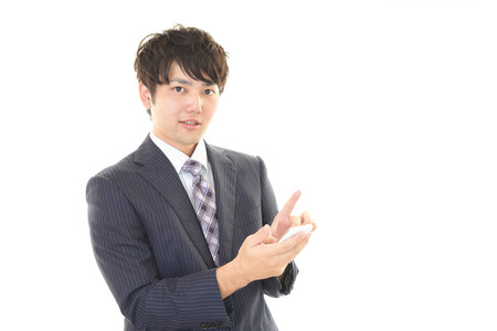 Businessman holding a smart phoneの写真素材