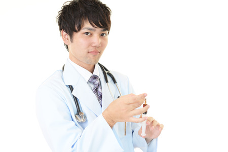 Portrait male doctor isolated on white backgroundの写真素材