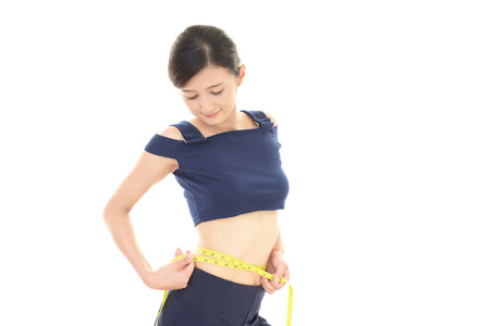 Woman who is measuring her waistの写真素材
