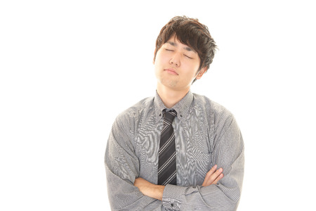 Tired Asian businessmanの写真素材