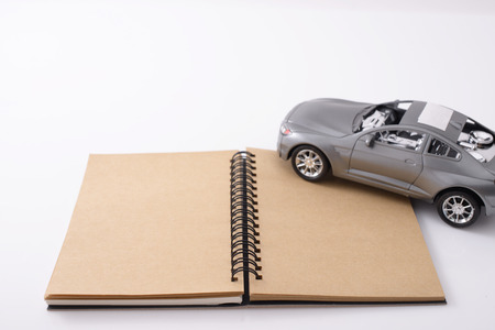 Notebook and toy carの写真素材