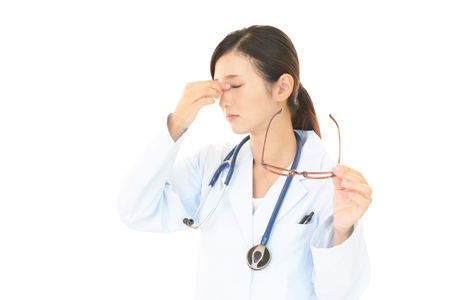 Tired Asian medical doctorの写真素材