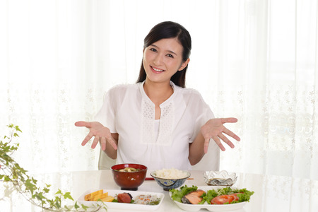 Woman who enjoys Japanese foodの写真素材