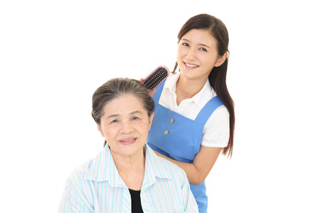 Smiling old woman and young ladyの写真素材