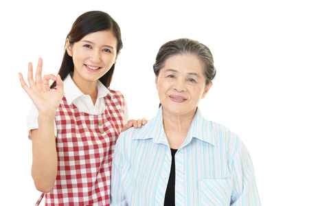 Smiling old woman and young ladyの写真素材