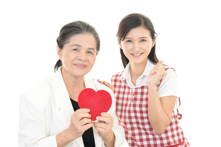 Smiling old woman and young ladyの写真素材