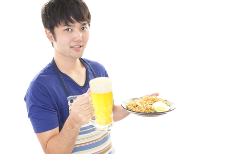 Smiling Asian waiterの写真素材