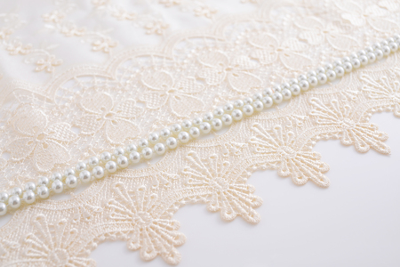 Beautiful lace fabric with necklaceの写真素材