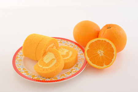 Delicious roll cake with orangeの写真素材