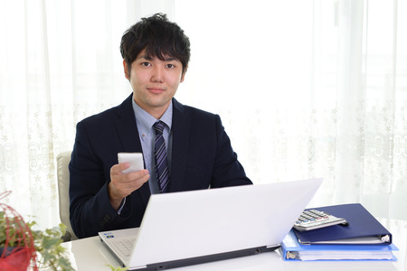 Smiling Asian businessmanの写真素材