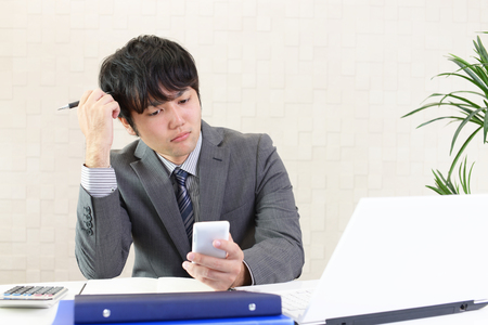 Disappointed Asian businessmanの写真素材