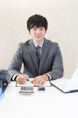 Smiling Asian businessmanの写真素材