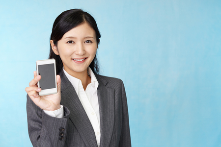 Woman with a smart phoneの写真素材