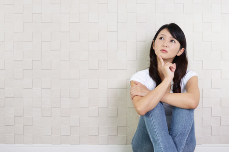 Woman with an uneasy lookの写真素材