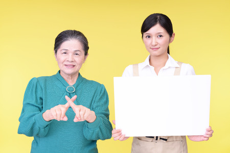 Smiling old woman and young ladyの写真素材