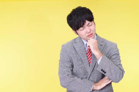 Disappointed Asian businessmanの写真素材