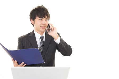 Man who is talking on a smart phoneの写真素材