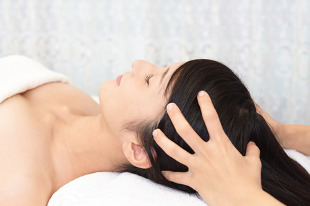 Woman having relaxing massage in spa salonの写真素材