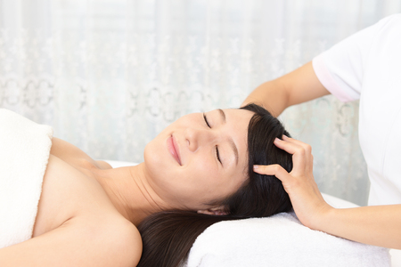 Woman having relaxing massage in spa salonの写真素材