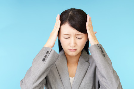 Business woman having a headacheの写真素材