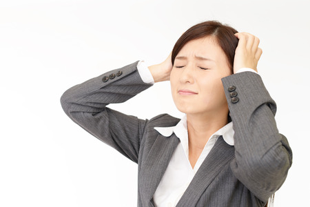 Business woman having a headacheの写真素材