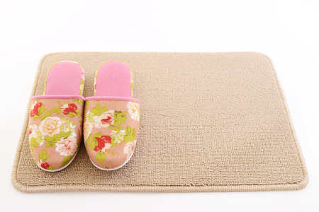 Slippers on the matの写真素材