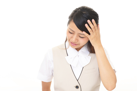 Disappointed Asian business womanの写真素材