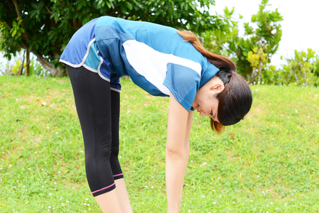 Beautiful woman doing stretchの写真素材