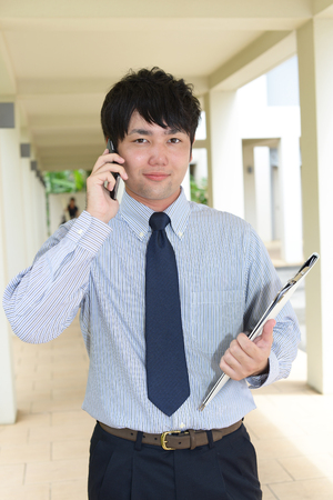 Man who is talking on a smart phoneの写真素材
