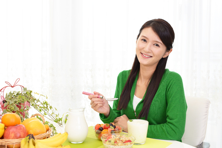 Woman who eats breakfastの写真素材