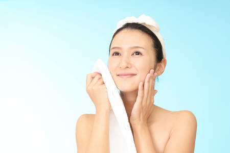 Woman washing her faceの写真素材