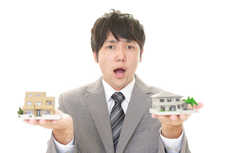 Surprised Asian businessmanの写真素材