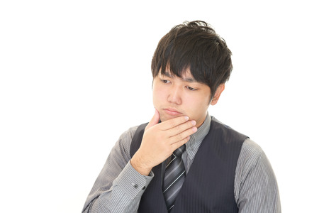 Depressed Asian businessmanの写真素材