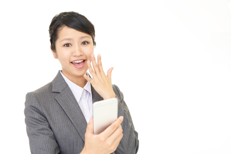 Woman with a smart phoneの写真素材